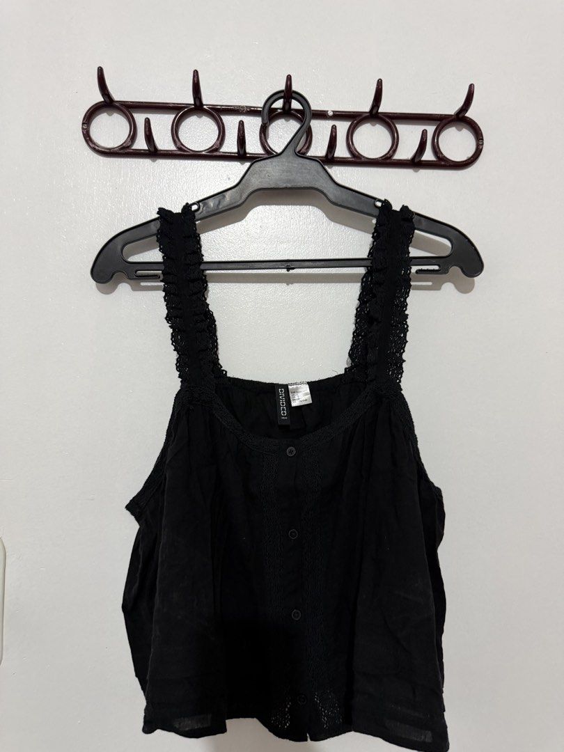 H&M Divided Black Camisole Top Size L (Category: Sleeveless) located in Las Pinas. Submitted by milkydeclutter (Listing ID 1465938120, Image 1). Description: - Brand: H&M Divided - Size: Large - Color: Black - Details: Button-down front, textured center panel, square neckline, and ruffled lace straps - Material: Lightweight fabric, ideal for warm weather or layering - Condition: Good overall.