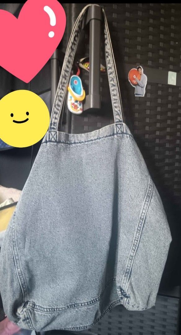 H&M Divided Denim Tote Bag (Category: Tote Bags) located in Manila. Submitted by fiercebird_38dcf5 (Listing ID 1465882459, Image 1). Description: - Brand: H&M Divided - Style: Denim tote bag / everyday carryall - Color: Classic grey wash with dark blue interior lining - Features: Sturdy shoulder straps, structured bottom stitching, roomy interior - Condition: Clean inside and out, great for books, laptops, and daily essentials.