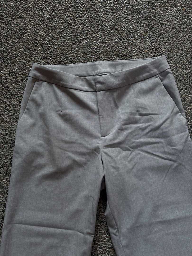 H&M Divided Grey Tailored Trousers Size US 8 (Category: Trousers) located in San Fernando. Submitted by gigikyla (Listing ID 1465927010, Image 2). Description: - Brand: H&M Divided - Size: EUR 40 / US 8 - Color: Grey - Style: Wide-leg trousers with tailored waist, belt loops, and front pockets - Material: Smooth fabric with slight stretch - Condition: Great versatile piece for office wear or casual outings.