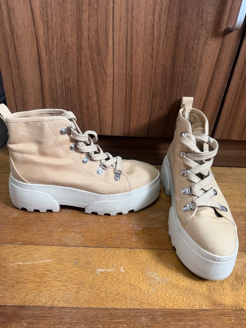 H&M Shoes (Category: Sneakers) located in Manila. Submitted by ilovebags_ (Listing ID 1465788687, Image 3). Description: - Brand: H&M Divided - Style: Beige canvas high-top sneakers with chunky platform lug sole - Size: EUR 37 / US 6 / CN 235(1.5) - Details: Silver-tone metal lace hooks and back pull tab - Versatile neutral color that goes with everything.