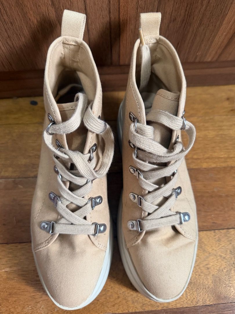 H&M Shoes (Category: Sneakers) located in Manila. Submitted by ilovebags_ (Listing ID 1465788687, Image 2). Description: - Brand: H&M Divided - Style: Beige canvas high-top sneakers with chunky platform lug sole - Size: EUR 37 / US 6 / CN 235(1.5) - Details: Silver-tone metal lace hooks and back pull tab - Versatile neutral color that goes with everything.