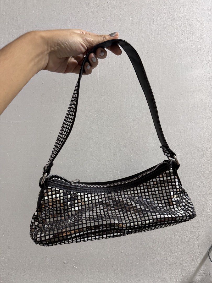 H&M Silver metallic mosaic shoulder bag (Category: Shoulder Bags) located in Pasig City. Submitted by miss_abuelita (Listing ID 1465929574, Image 1). Description: - Eye-catching black shoulder bag covered in shiny silver mosaic squares - Secure top zipper closure for your essentials - Stylish black trim, side tabs, and durable metal hardware - Compact and versatile size great for parties, nights out, or daily errands - Excellent, clean condition 