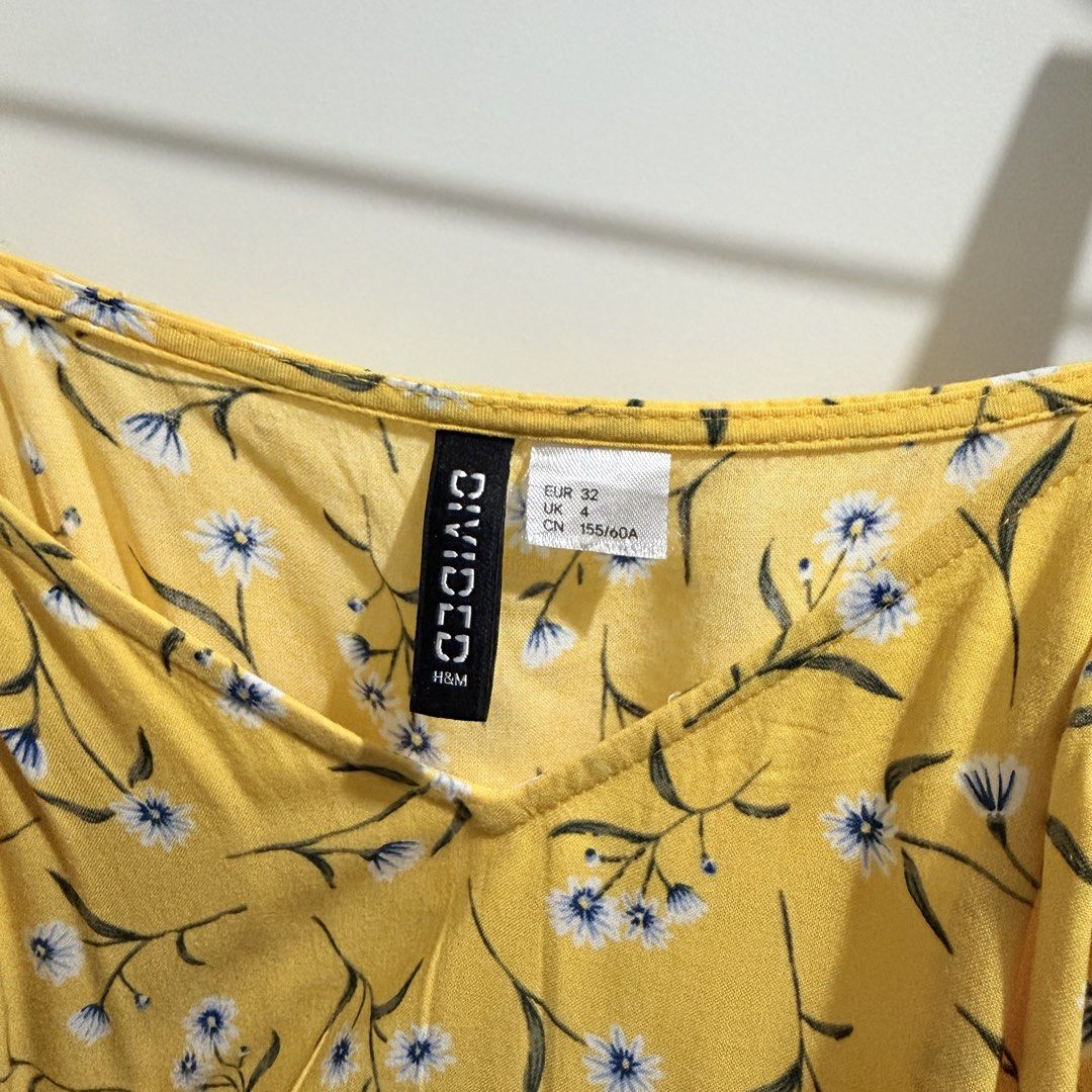 H&M Yellow Floral Romper (Category: Rompers) located in Pasay City. Submitted by kaikylestrinkets (Listing ID 1465890123, Image 2). Description: ✿ H&M ✿ 32 (fits XS-S) ✿ Yellow with white, blue, & green details ✿ With minor but barely noticeable flaws ✿ Romper (shorts) with adjustable straps and garterized waist.