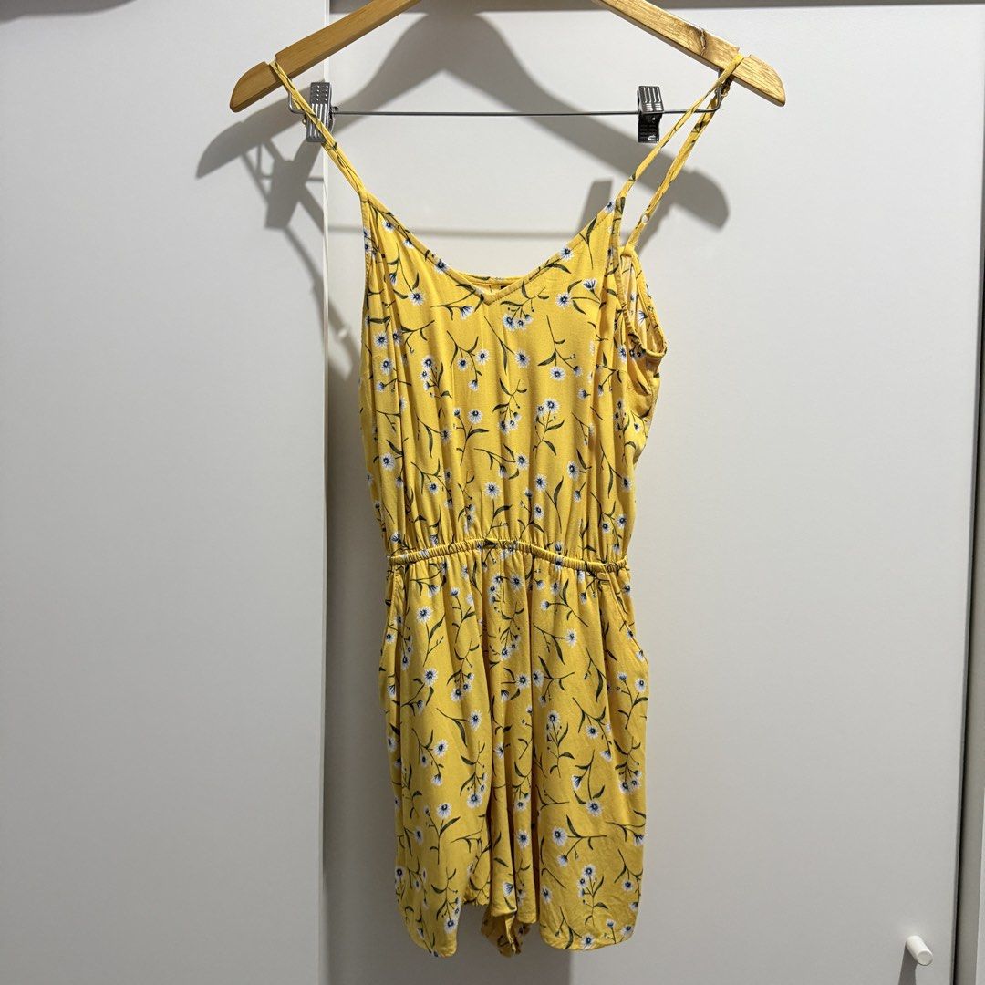 H&M Yellow Floral Romper (Category: Rompers) located in Pasay City. Submitted by kaikylestrinkets (Listing ID 1465890123, Image 1). Description: ✿ H&M ✿ 32 (fits XS-S) ✿ Yellow with white, blue, & green details ✿ With minor but barely noticeable flaws ✿ Romper (shorts) with adjustable straps and garterized waist.