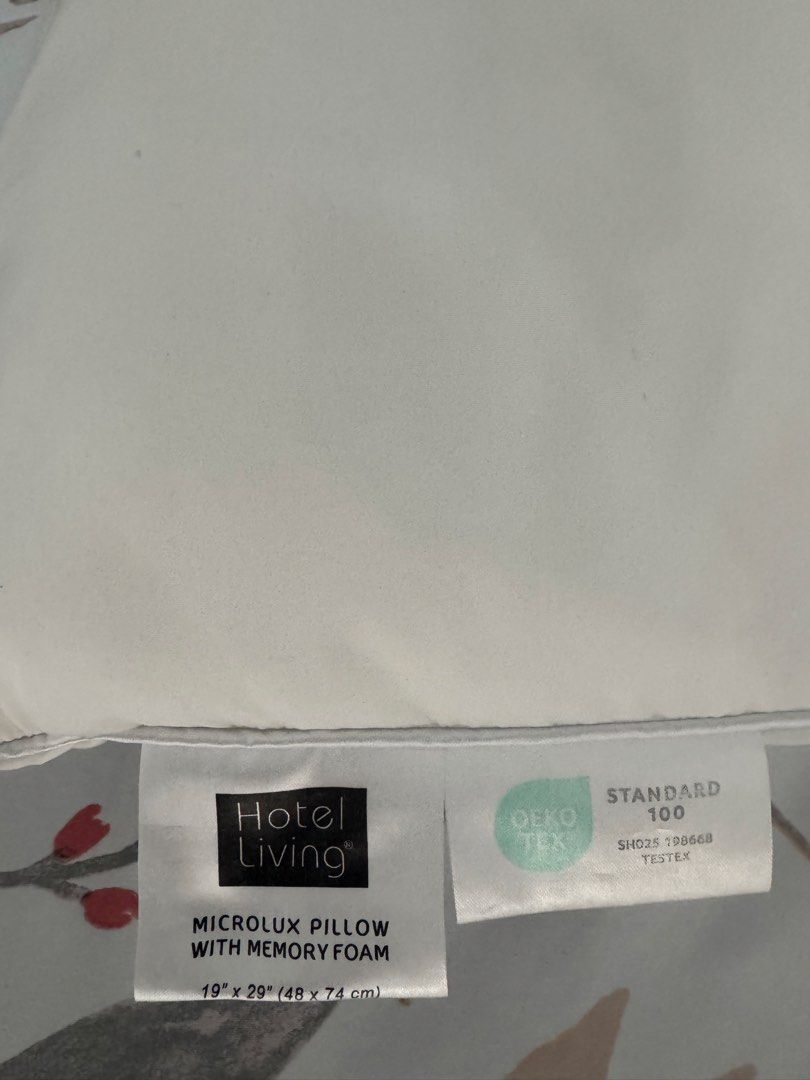 Hotel Living Microlux Pillow with Memory Foam (Category: Bedding & Towels) located in Manila. Submitted by decluterthings888 (Listing ID 1465953343, Image 1). Description: - Brand: Hotel Living Microlux Pillow - Filling: Memory foam inside for superior support - Certification: Standard 100 OEKO-TEX certified materials - Size: Standard 19" x 29" (48 x 74 cm) - Design: Clean white color with stylish piping edges - Feel: Plush, comfortable, and grea