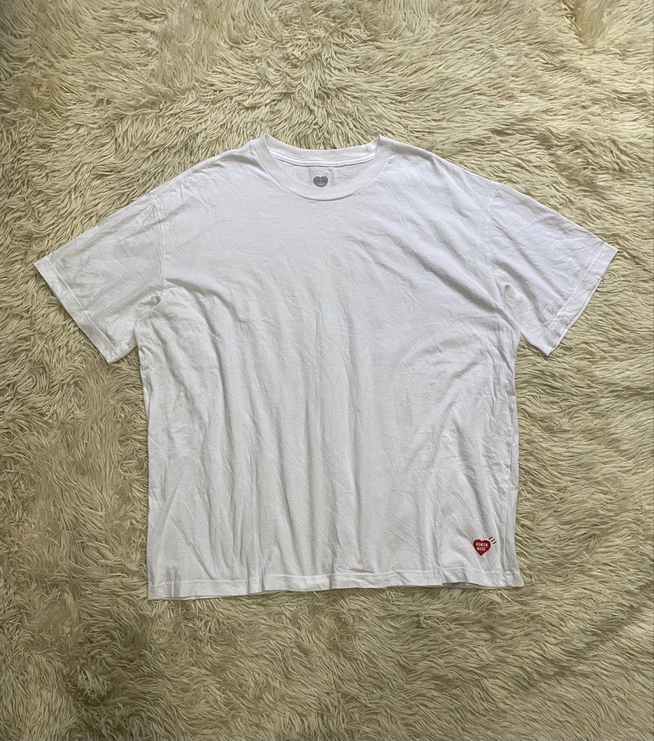 Human Made White Graphic Heart Tee Large (Category: Shirts) located in Manila. Submitted by switchcity (Listing ID 1465898721, Image 1). Description: - Brand: Human Made (Otsumo Co. Ltd.) - Color: White - Size: Large - Material: 100% premium cotton - Design: Classic crew neck with iconic red heart logo near the bottom hem and grey heart graphic print on the inside collar - Condition: Brand new / Excellent everyday basic - Perfect staple piece for