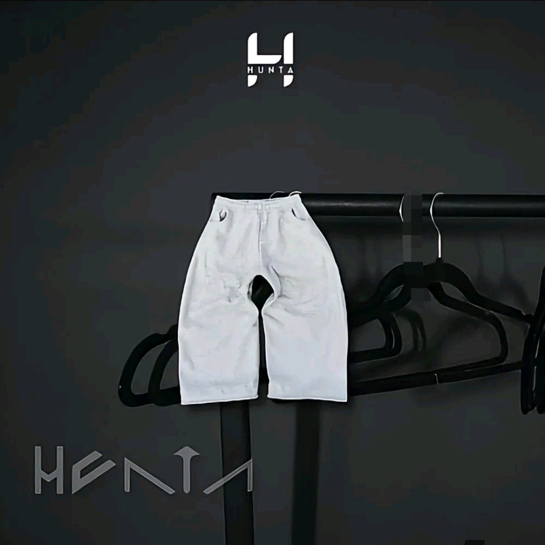 HUNTA White Wide Leg Pants (Category: Joggers) located in Manila. Submitted by jcarlcalib66068 (Listing ID 1465827080, Image 1). Description: - Brand: HUNTA - Color: White - Style: Wide leg pants with a clean, structured cut and relaxed fit - Vibe: Great everyday streetwear piece - Condition: Excellent, hangs well and looks sharp.