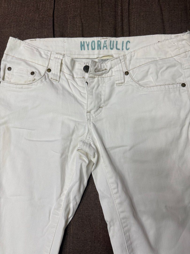 Hydraulic White Jeans (Category: Jeans) located in Quezon City. Submitted by mt031199 (Listing ID 1465947459, Image 3). Description: - Brand: Hydraulic - Color: White denim - Style: Classic five-pocket design with button fly closure - Details: Contrast stitching and branded interior waistband print - Fit/Use: Great staple piece for effortless casual outfits.