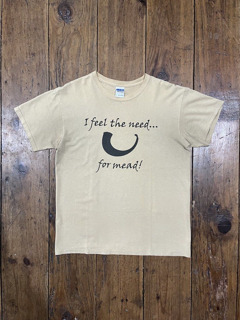 “I feel the need... for mead!” Statement Tee Shirt (Category: Shirts) located in Baguio. Submitted by fishy___fish (Listing ID 1465890353, Image 1). Description: “I feel the need... for mead!” Statement Tee Shirt Tagged M Width: 21” Length: 27” Fits L Has armpit stains.