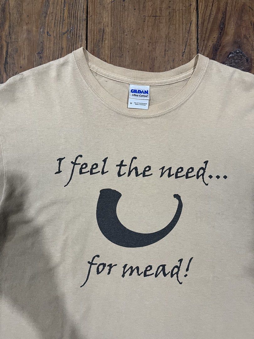 “I feel the need... for mead!” Statement Tee Shirt (Category: Shirts) located in Baguio. Submitted by fishy___fish (Listing ID 1465890353, Image 2). Description: “I feel the need... for mead!” Statement Tee Shirt Tagged M Width: 21” Length: 27” Fits L Has armpit stains.