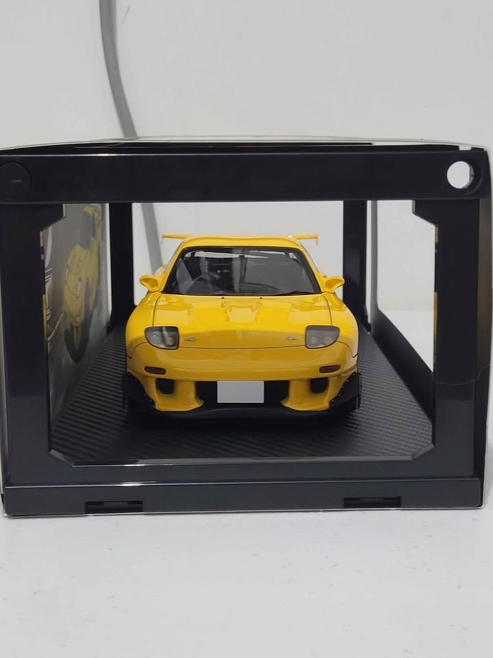 Ignition Model Initial D Mazda RX-7 FD3S 1:18 Yellow (Category: Vehicle & Diecast Models) located in Pasig City. Submitted by hobbystuff07 (Listing ID 1465821152, Image 3). Description: Displayed in acrylic box Dirty card board banner back Meetups only at megamall, robinsons galleria, opus mall, sm east ortigas, greenhills.