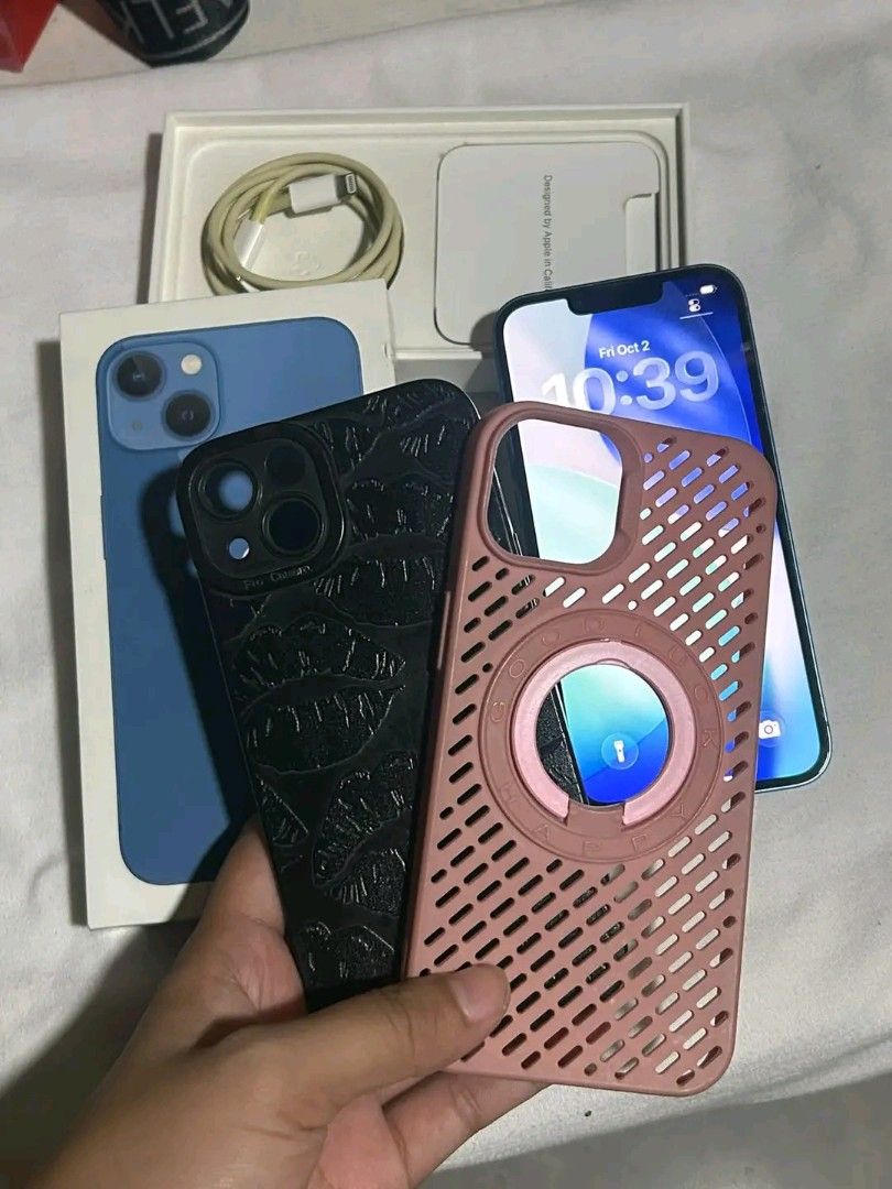 IPHONE 13 256gb (Category: iPhone 13 Series) located in Manila. Submitted by bevermore (Listing ID 1465807409, Image 1). Description: FOR SALE IPHONE 13 BLUE 256 gb 100% battery health(newly replaced) All buttons working Face ID No sim restrictions (factory unlocked) ZPA local variant NTC approved With original box and cord Free 2 cases No issue of repair and all parts are original except for the battery With noticable scratches(bottom part) and 