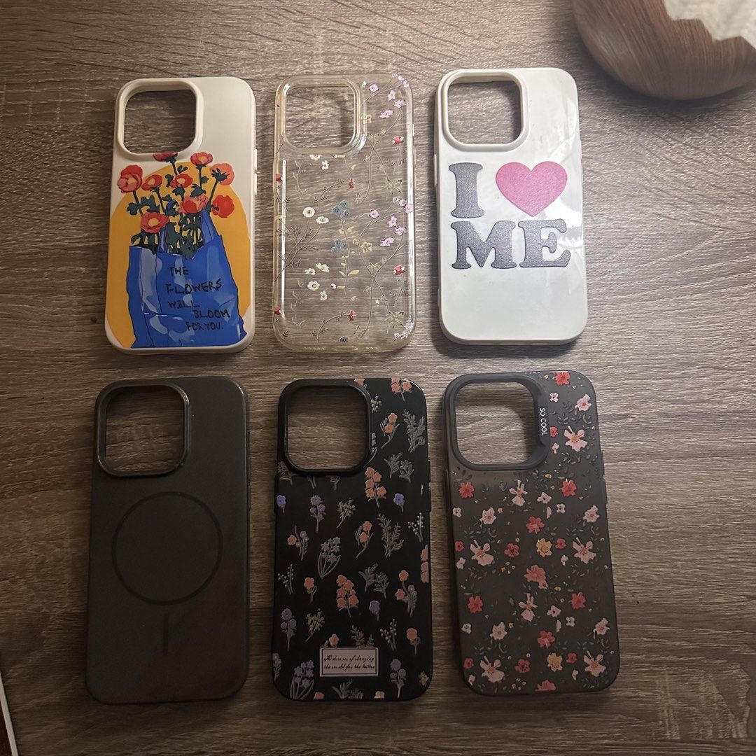 iPhone 14 pro phone cases (TAKE ALL) (Category: Cases & Sleeves) located in Baguio. Submitted by izzivsworld (Listing ID 1465875197, Image 2). Description: - Compatible Model: iPhone 14 Pro - Quantity: 6 different cases included - Designs: Artsy floral painting, transparent botanical, white 'I <3 ME' graphic, minimalist black with MagSafe, and two black floral patterns - Condition: Pre-loved, well-maintained, and ready for use - Perfect for daily