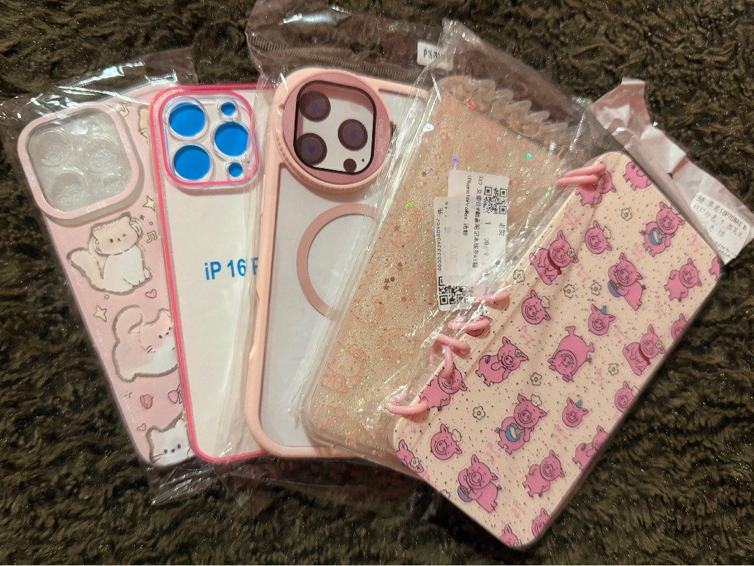 Iphone 16 pro max pink bundle (Category: Cases & Sleeves) located in Antipolo. Submitted by micheicheim (Listing ID 1465822297, Image 1). Description: IP16PM CASE BUNDLE 👉🏻2 NOTEBOOK STYLE 👉🏻1 CAMERA LENS PROTECTOR CASE 👉🏻1 GLOW IN THE DARK CASE 👉🏻1 CAT CASE.