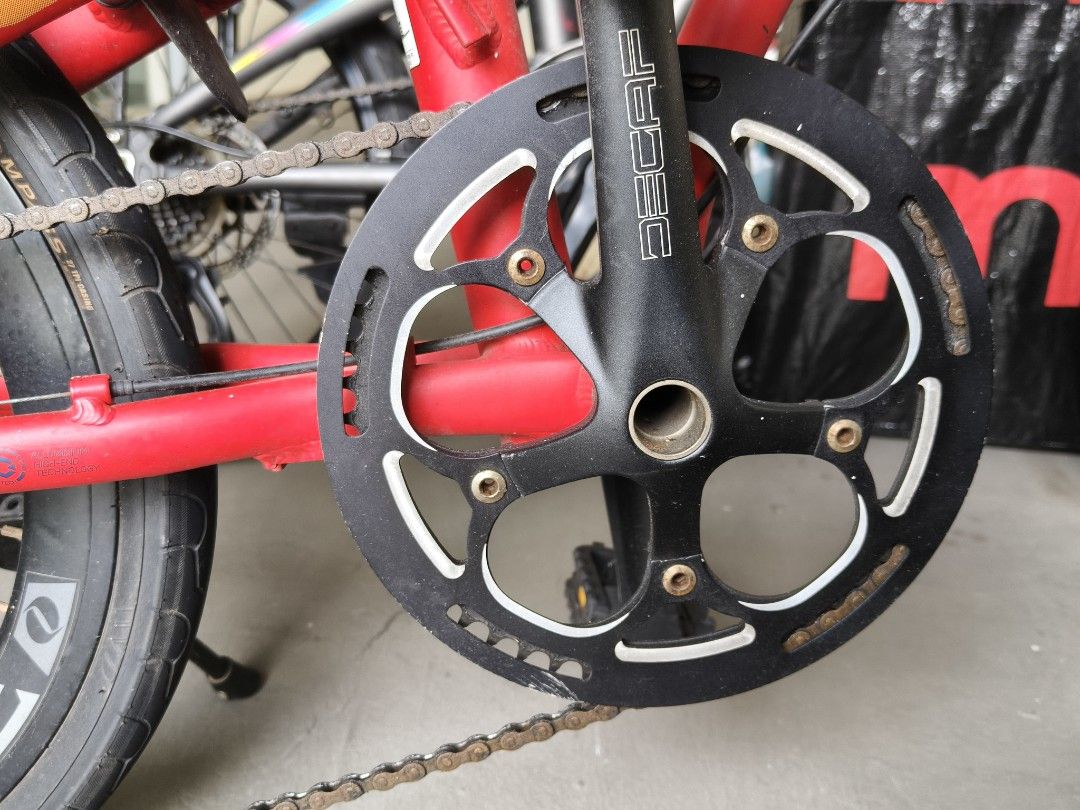 JAVA Folding Bicycle Red (Category: Bicycles) located in Singapore. Submitted by stiforp_2025 (Listing ID 1465909006, Image 5). Description: - Red JAVA folding bike with 9gears - Shimano Altus drivetrain with Decaf wheels and crankset - Includes useful accessories: handlebar bag, water bottle holder, kickstand, and rear pouch - Folding mechanism is fully functional and smooth.