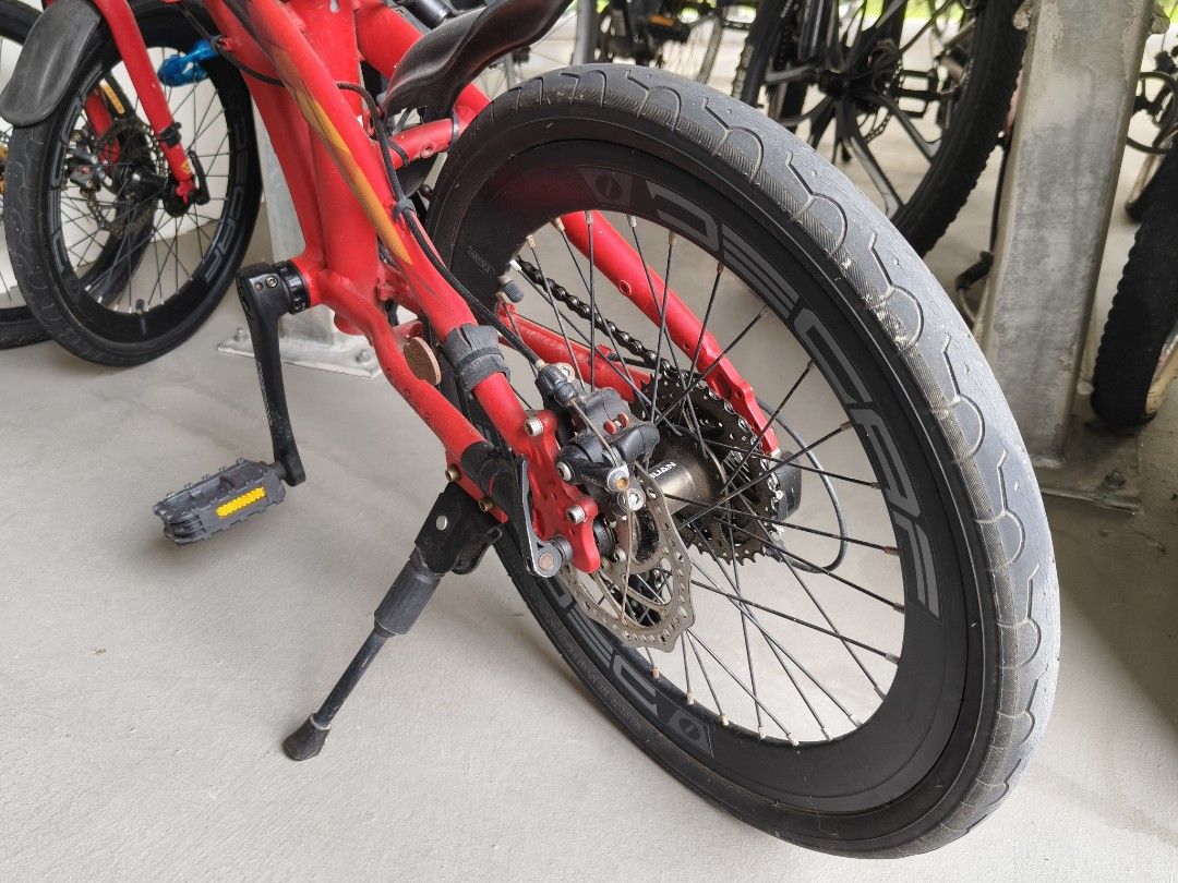 JAVA Folding Bicycle Red (Category: Bicycles) located in Singapore. Submitted by stiforp_2025 (Listing ID 1465909006, Image 2). Description: - Red JAVA folding bike with 9gears - Shimano Altus drivetrain with Decaf wheels and crankset - Includes useful accessories: handlebar bag, water bottle holder, kickstand, and rear pouch - Folding mechanism is fully functional and smooth.