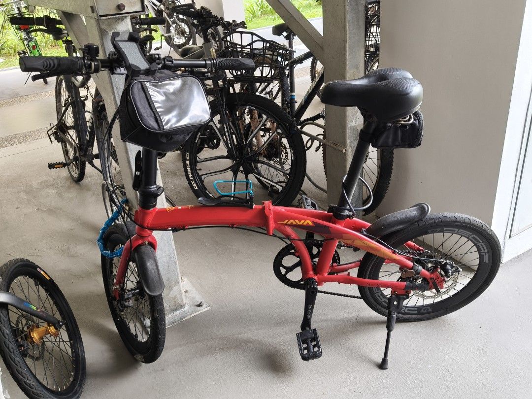 JAVA Folding Bicycle Red (Category: Bicycles) located in Singapore. Submitted by stiforp_2025 (Listing ID 1465909006, Image 1). Description: - Red JAVA folding bike with 9gears - Shimano Altus drivetrain with Decaf wheels and crankset - Includes useful accessories: handlebar bag, water bottle holder, kickstand, and rear pouch - Folding mechanism is fully functional and smooth.
