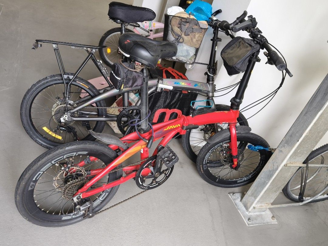 JAVA Folding Bicycle Red (Category: Bicycles) located in Singapore. Submitted by stiforp_2025 (Listing ID 1465909006, Image 3). Description: - Red JAVA folding bike with 9gears - Shimano Altus drivetrain with Decaf wheels and crankset - Includes useful accessories: handlebar bag, water bottle holder, kickstand, and rear pouch - Folding mechanism is fully functional and smooth.