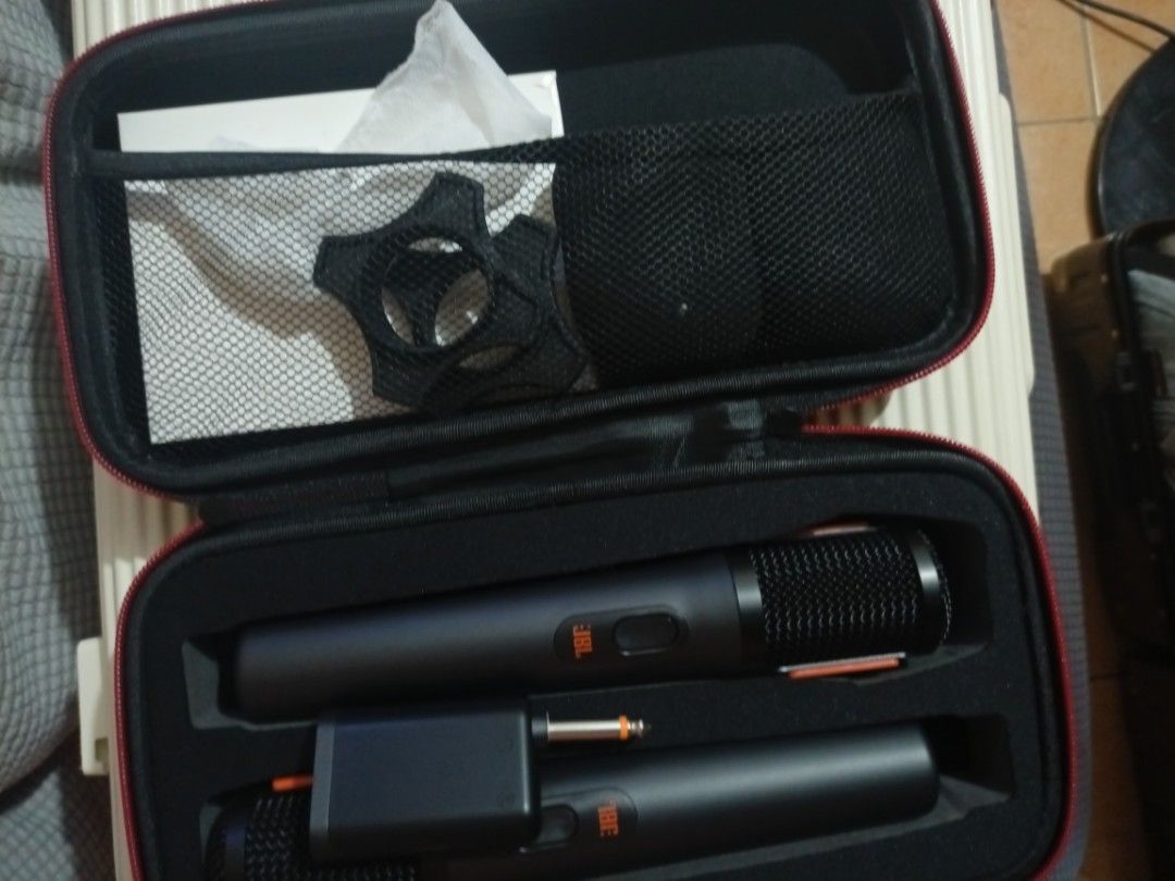 JBL Wireless Microphone Set with Case (Category: Microphones) located in Manila. Submitted by tenanboy (Listing ID 1465778199, Image 3). Description: - Brand: JBL Wireless Microphone Set (Black) - Inclusions: 2x handheld microphones, wireless receiver adapter, and custom black/red zipper hard case - Extras: Manuals and anti-rolling rings stored in the mesh pouch - Condition: Excellent / Ready to use - Ideal for: Karaoke nights, parties, and event