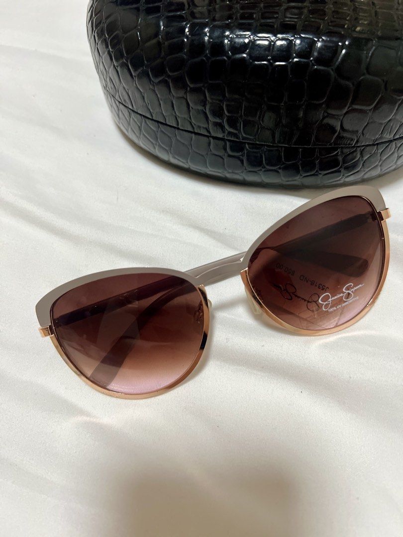 Jessica Simpson Sunglasses with Case (Category: Sunglasses & Eyewear) located in Manila. Submitted by whitepolka2014 (Listing ID 1465901527, Image 1). Description: - Brand: Jessica Simpson - Model: J5316-ND (100% UV absorptive) - Design: Rose gold rims with trendy brown gradient lenses - Condition: Brand new with $50 price sticker on the lens - Inclusion: Free black faux-crocodile hard shell case with secure snap closure - Perfect for daily wear 