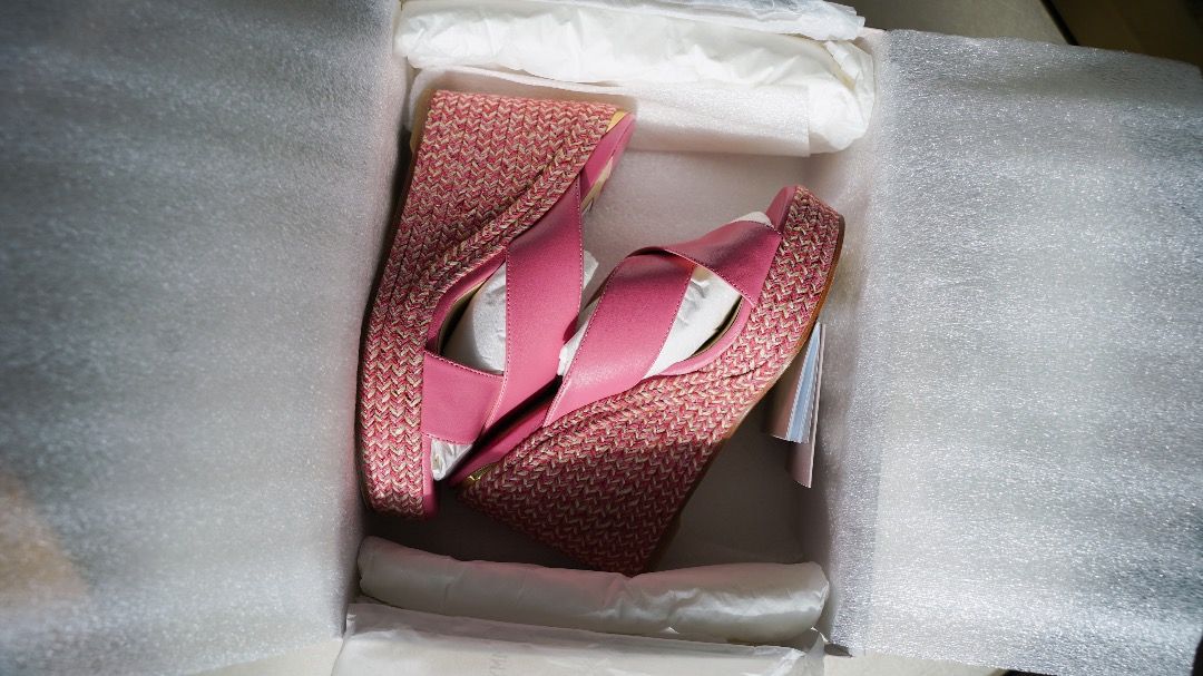 Jimmy Choo Pink Wedge Sandals (Category: Wedges) located in Pasig City. Submitted by laagn.ph (Listing ID 1465763210, Image 1). Description: - Brand: Jimmy Choo - Type: Wedge sandals with woven espadrille platforms - Material: Pink leather with chic crisscross straps - Condition: Brand new, unworn, with internal packaging preserved - Inclusions: Original branded box, dust wrap, and tag included.