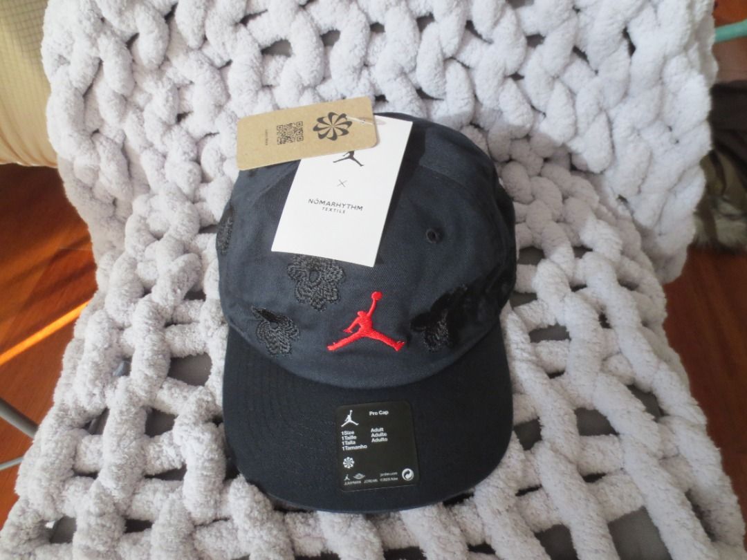 Jordan x Nomarhythm Textile Cap Black (Category: Caps & Hats) located in Quezon City. Submitted by joemd.joemd (Listing ID 1465847270, Image 1). Description: - Brand: Jordan brand x Nomarhythm Textile Collaboration (Japan) - Condition: Brand new, never worn, straight from the store - Color/Design: Dark grey body with black textured floral embroidery and bright red Jumpman logo - Details: Flat black brim with original stickers and tags still attac