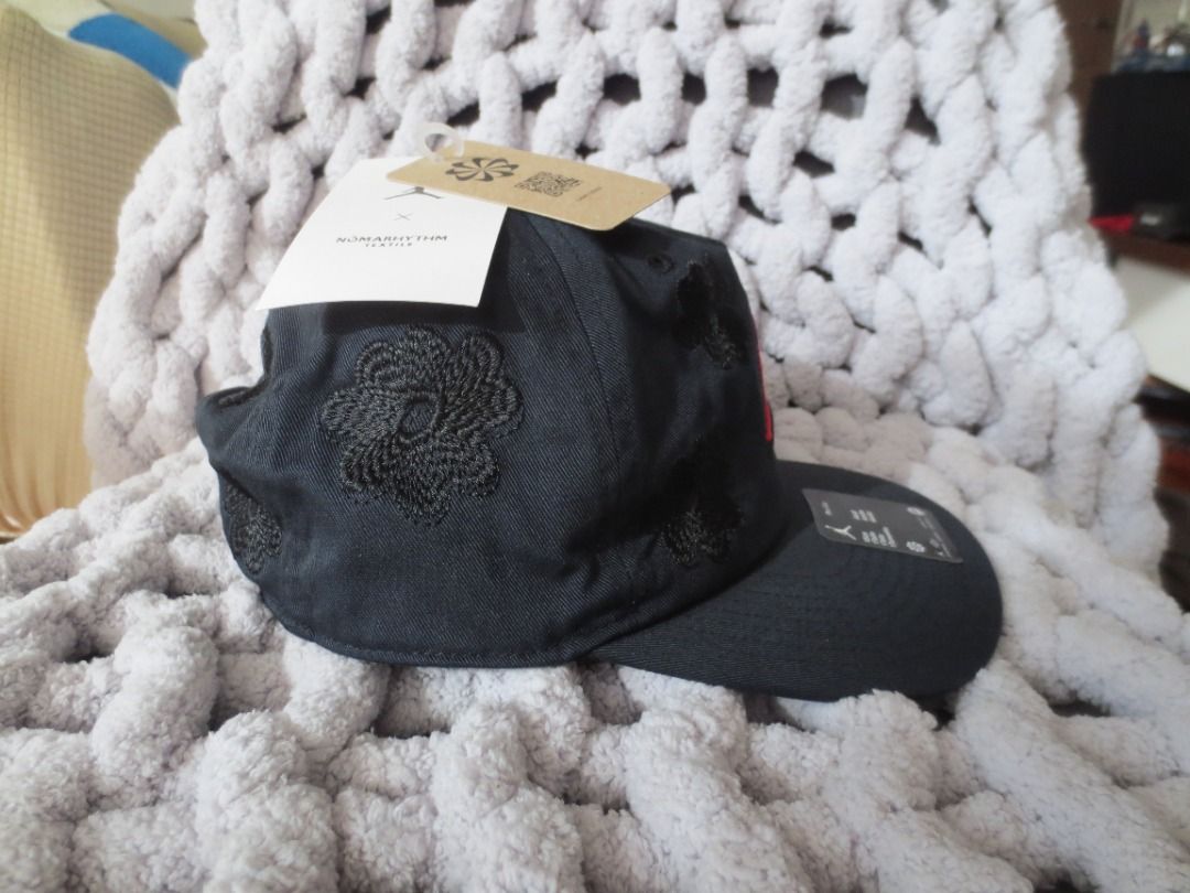 Jordan x Nomarhythm Textile Cap Black (Category: Caps & Hats) located in Quezon City. Submitted by joemd.joemd (Listing ID 1465847270, Image 2). Description: - Brand: Jordan brand x Nomarhythm Textile Collaboration (Japan) - Condition: Brand new, never worn, straight from the store - Color/Design: Dark grey body with black textured floral embroidery and bright red Jumpman logo - Details: Flat black brim with original stickers and tags still attac