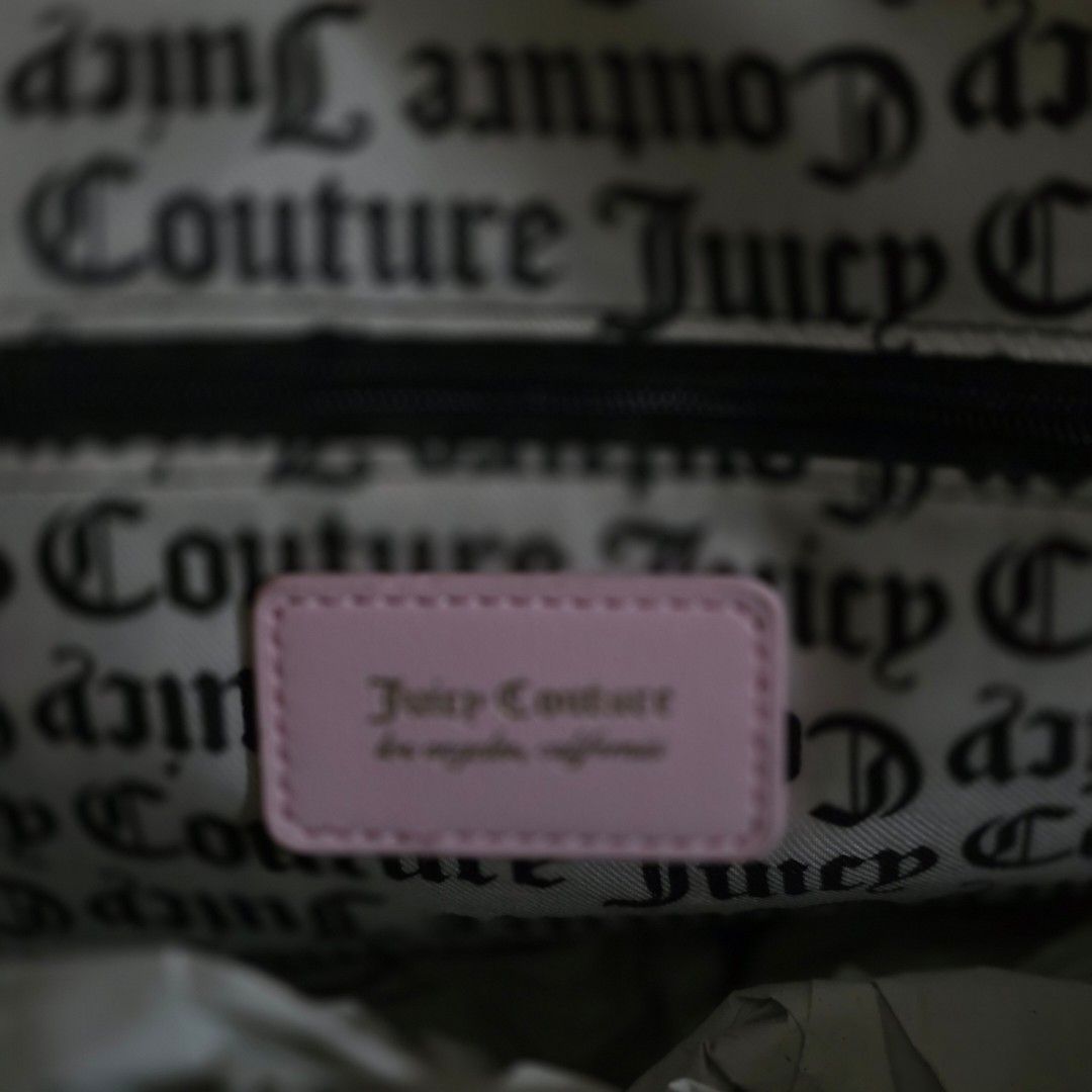 Juicy Couture Dreamy Juicy Medium Backpack (Category: Backpacks) located in Manila. Submitted by carnastraea (Listing ID 1465899140, Image 3). Description: Add the ultimate Y2K vibe to your outfit with this gorgeous Juicy Couture Dreamy Juicy Backpack! Crafted from high-quality pink faux leather with a beautiful, subtle textured grain, this bag features iconic Juicy styling. The front pocket showcases an embossed vertical stripe pattern topped wi