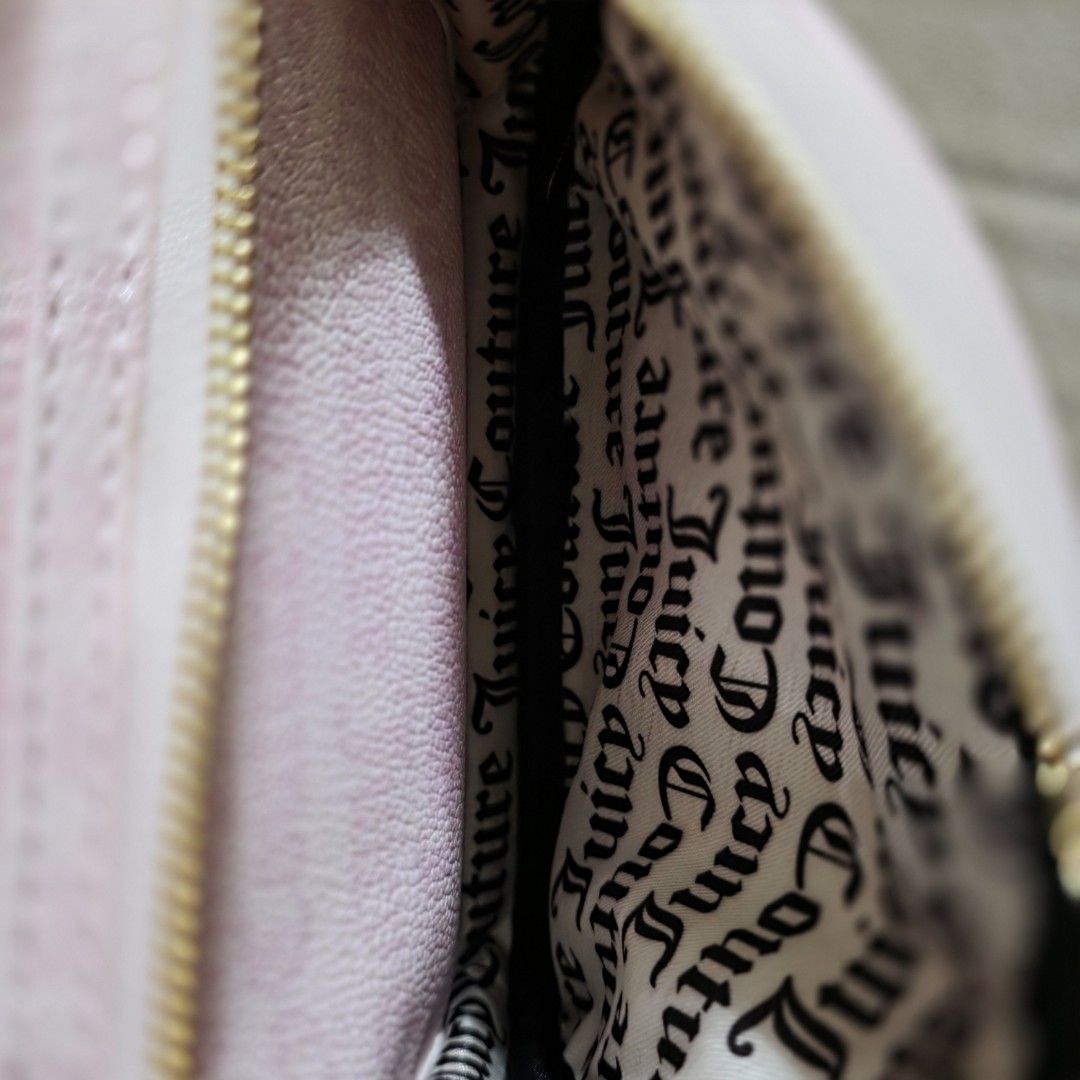 Juicy Couture Dreamy Juicy Medium Backpack (Category: Backpacks) located in Manila. Submitted by carnastraea (Listing ID 1465899140, Image 2). Description: Add the ultimate Y2K vibe to your outfit with this gorgeous Juicy Couture Dreamy Juicy Backpack! Crafted from high-quality pink faux leather with a beautiful, subtle textured grain, this bag features iconic Juicy styling. The front pocket showcases an embossed vertical stripe pattern topped wi