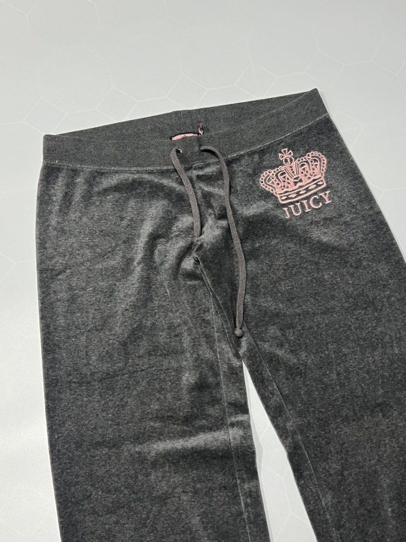 Juicy Couture Grey Velour Track Pants (Category: Joggers) located in Caloocan City. Submitted by lostarchive_55 (Listing ID 1465918135, Image 3). Description: - Brand: Juicy Couture - Color: Dark grey with pink crown and logo graphic - Size: Small (fits true to size) - Material: 80% cotton, 20% polyester velour blend - Fit: Classic relaxed fit with straight legs - Features: Adjustable drawstring waistband and hip pocket - Condition: Good pre-love