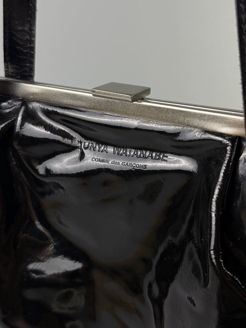 Junya Watanabe - Patent Leather Clasp Bag (Category: Shoulder Bags) located in Pasig City. Submitted by on_the_trend (Listing ID 1465792383, Image 2). Description: Condition: 9/10 Flaws: Normal creases, Patent fogging, Minor scuffs Made in: Japan Inclusion: None.