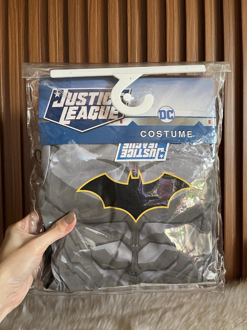 Justice League Batman Costume DC Comics (Category: Babies & Kids Fashion) located in Navotas City. Submitted by mommybabyc (Listing ID 1465876282, Image 1). Description: - Brand: DC Comics Justice League Batman costume - Condition: Brand new, unopened in original packaging with hanger - Design: Classic grey suit with iconic yellow and black bat symbol - Features: Full printed muscle detailing on the front - Perfect for: Costume parties, Halloween