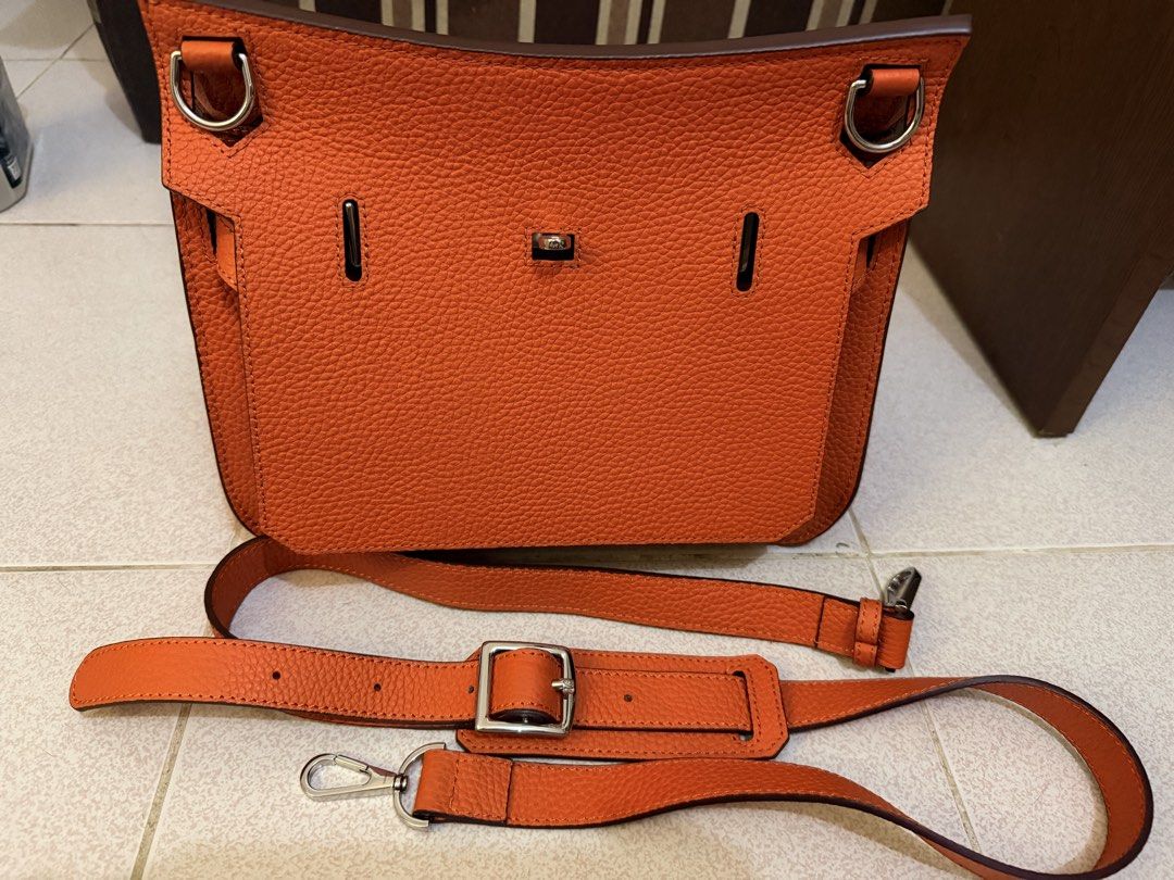 Jypsiere Orange Shoulder Bag with Silver Hardware (Category: Luxury Bags & Wallets) located in Manila. Submitted by gizmoi (Listing ID 1465825957, Image 3). Description: - shoulder bag in a stunning bright orange pebble leather - Sleek silver hardware closures and accents - Clean interior lining equipped with convenient zipper and slip pockets - Includes an adjustable matching leather strap for versatile styling .