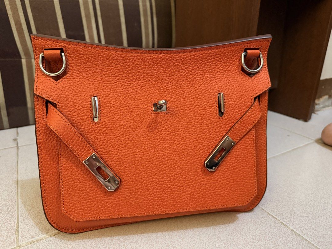 Jypsiere Orange Shoulder Bag with Silver Hardware (Category: Luxury Bags & Wallets) located in Manila. Submitted by gizmoi (Listing ID 1465825957, Image 1). Description: - shoulder bag in a stunning bright orange pebble leather - Sleek silver hardware closures and accents - Clean interior lining equipped with convenient zipper and slip pockets - Includes an adjustable matching leather strap for versatile styling .