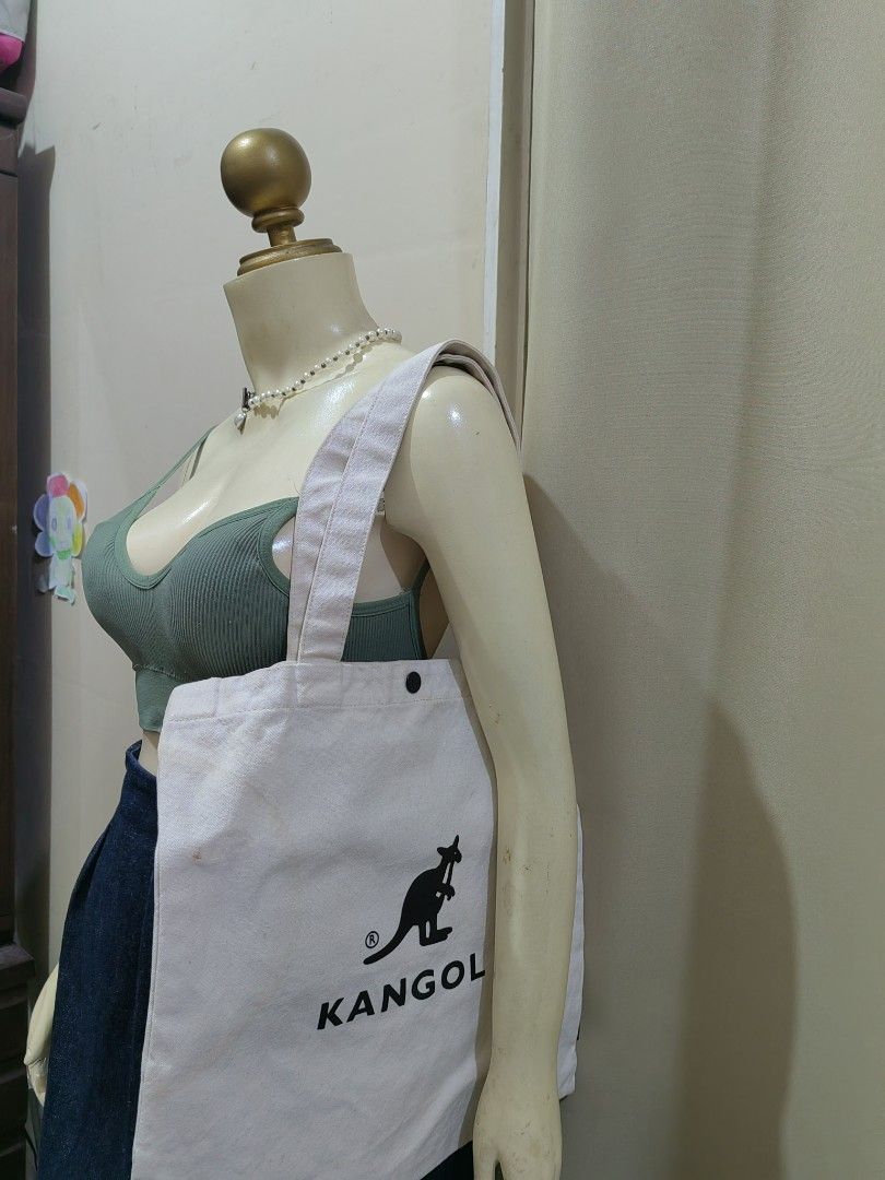 Kangol Canvas Tote Bag (Category: Tote Bags) located in Makati City. Submitted by prelovedtreatedwithlove (Listing ID 1465798964, Image 1). Description: - Authentic Kangol off-white canvas tote bag - Heavy-duty 100% cotton fabric, sturdy build for daily use - Large tote - Dual top handles and convenient adjustable shoulder strap - Issue: need wash, last pic for reference A-231.