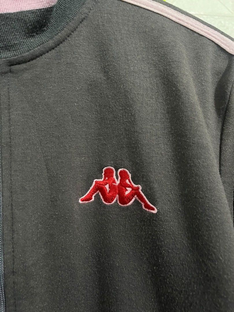Kappa Track Jacket Charcoal Grey with Pink Stripes (Category: Coats, Jackets and Outerwear) located in Talavera. Submitted by jamiegenc (Listing ID 1465891877, Image 3). Description: - Brand: Kappa 24x20 - Color: Dark grey with pink piping and striped ribbed trim - Logo: Red embroidered Omini logo on the chest - Features: Full front zipper, stand-up collar, two front slash pockets - Material: Soft, comfortable fabric - Condition: Excellent pre-lo