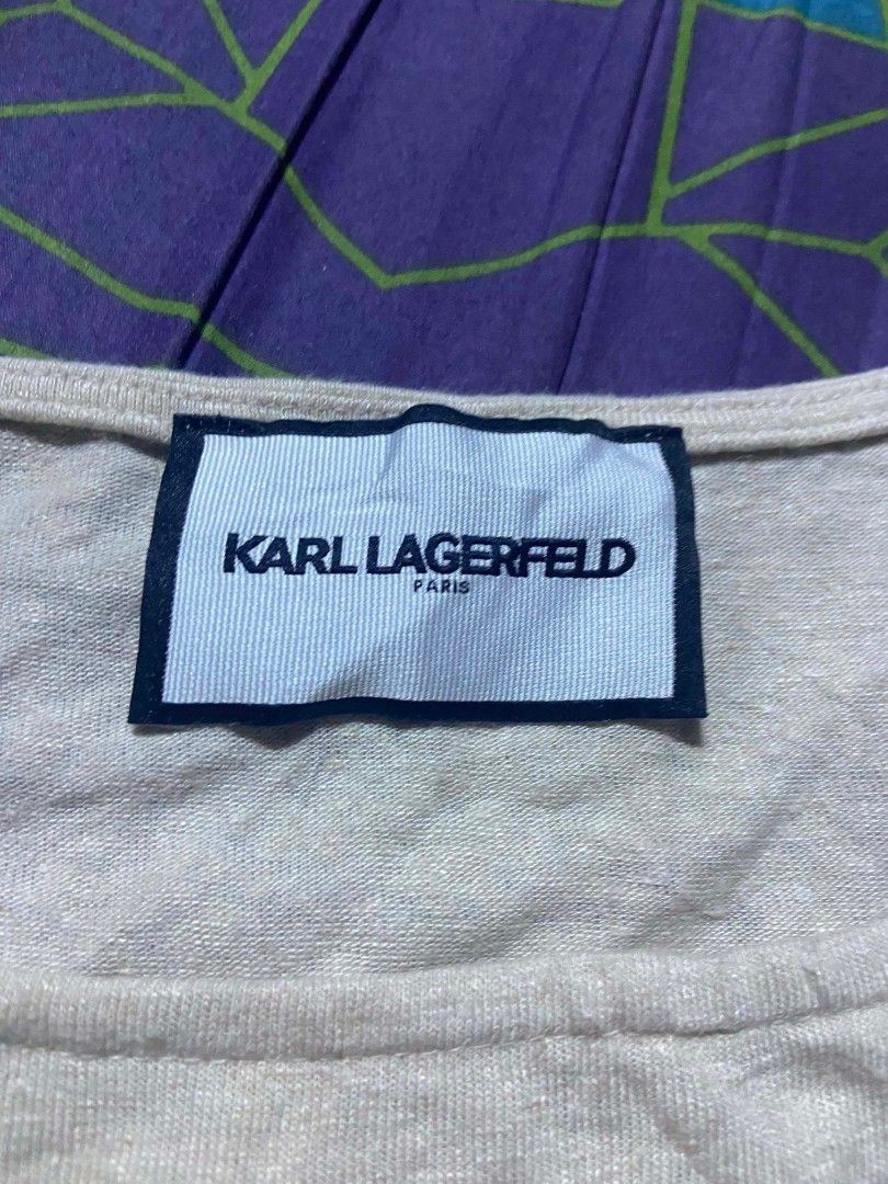Karl Lagerfeld square-neck capped sleeve top. (Category: Others Tops) located in Sindangan. Submitted by barak_ukay (Listing ID 1465911462, Image 3). Description: Color:light beige / sand / oatmeal color White-22x18 Good condition No issue.