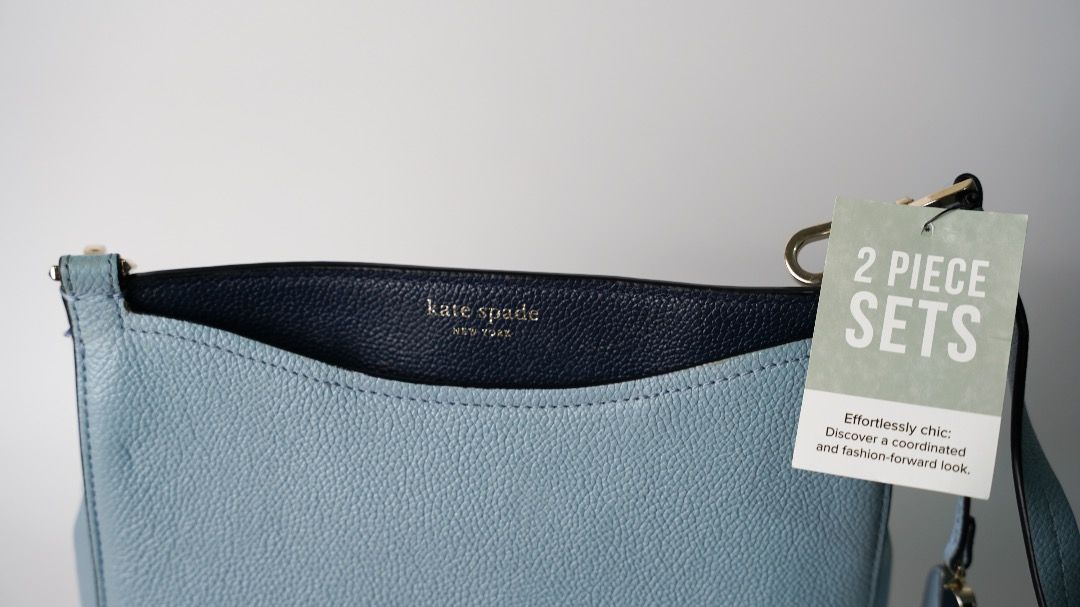 Kate Spade 2 Piece Handbag and Wallet Set (Category: Cross-body Bags) located in Pasig City. Submitted by laagn.ph (Listing ID 1465763609, Image 3). Description: - Brand: Kate Spade - Set includes: Matching crossbody handbag and zip-around wallet - Material: Premium pebble leather in blue and navy tones - Hardware: Elegant gold-tone hardware with logo lettering - Condition: Brand new with tag attached, never used and properly stored - Perfect coo