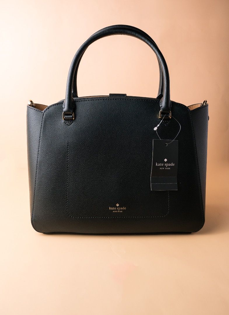 Kate Spade Black Leather Satchel Handbag (Category: Tote Bags) located in Pasig City. Submitted by laagn.ph (Listing ID 1465762150, Image 2). Description: - Brand new. Bought from USA. With paperbag - Authentic Kate Spade New York structured leather handbag - Color: Classic black with elegant gold-toned hardware - Features a chic top handle and secure front turn-lock closure - Convenient back slip pocket accented with a gold foil stamped logo lab