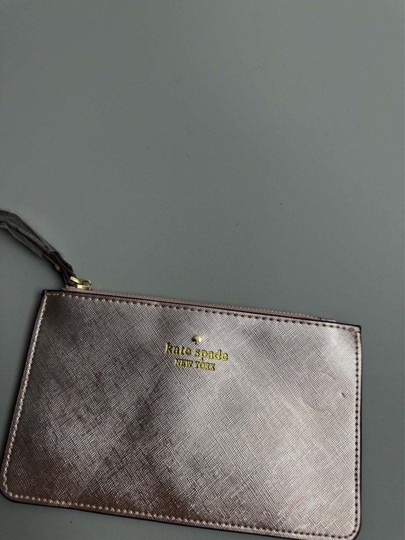 KATE SPADE NEW YORK (Category: Purses & Pouches) located in Guagua. Submitted by sweetboyy (Listing ID 1465767998, Image 3). Description: KATE SPADE NEW YORK METALLIC SILVER SAFFIANO LEATHER WRISTLET POUCH.