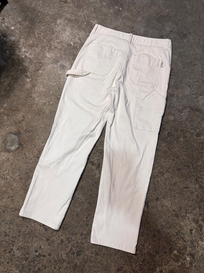 Kate Tw Bear White Cargo Pants with Charm (Category: Jeans) located in Pasig City. Submitted by dripthrift1600 (Listing ID 1465949555, Image 2). Description: - Brand: Kate Tw Bear - Color: White - Material: Corduroy texture all over - Fit: Straight leg - Features: Utility pockets, hammer loop at the back, branded button closure, and a removable TW metal charm on the front belt loop - Condition: Noticeable staining near the lower right leg - Dimes