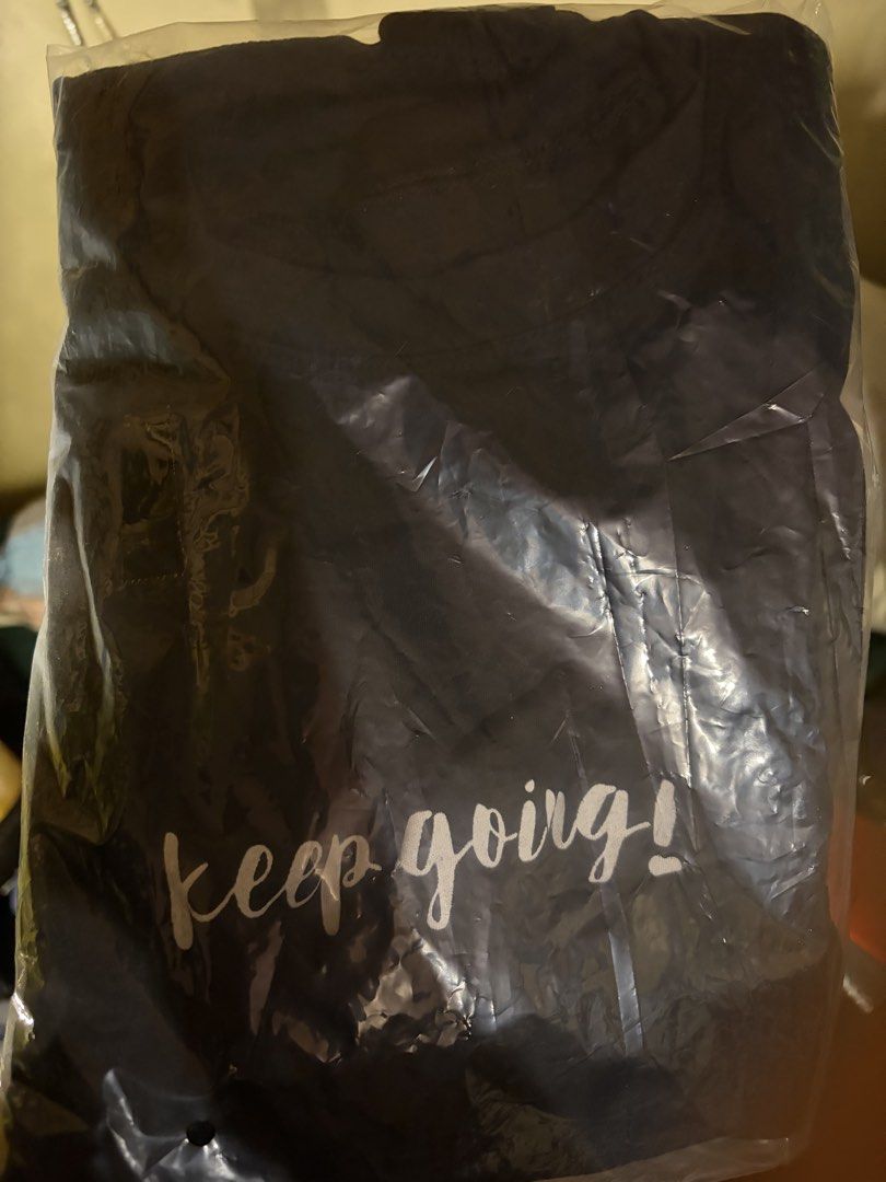 Keep Going Graphic T-Shirt (Category: Shirts) located in Quezon City. Submitted by jhosa888 (Listing ID 1465766659, Image 1). Description: - Color: Dark navy - Design: 'keep going!' text across lower front - Cut: Short sleeves with round neckline - Condition: Brand new, never worn or opened - Packaging: Still sealed in original clear plastic.