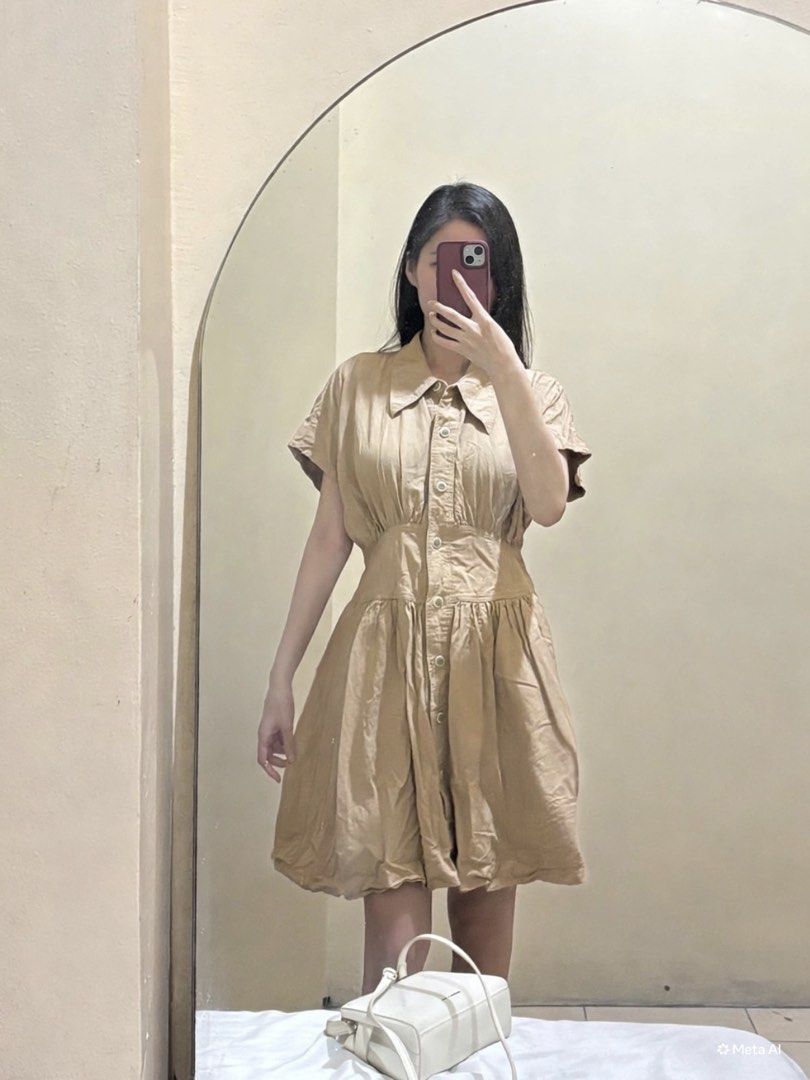 Khaki Button-Down Mini Polo Dress (Category: Dresses) located in Makati City. Submitted by passinggems (Listing ID 1465930627, Image 2). Description: - Waist 28-28.5 inches - Length 34 inches - Color: Beige / Neutral Khaki - Short-sleeve shirt dress with collared neckline and front button closure - Fitted paneled waistband with gathered details and a flared knee-length skirt - MOP: GCash or BDO - MOD: LBC or same-day delivery only. SF shouldered 