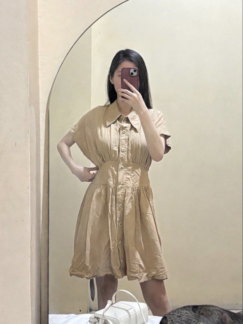 Khaki Button-Down Mini Polo Dress (Category: Dresses) located in Makati City. Submitted by passinggems (Listing ID 1465930627, Image 1). Description: - Waist 28-28.5 inches - Length 34 inches - Color: Beige / Neutral Khaki - Short-sleeve shirt dress with collared neckline and front button closure - Fitted paneled waistband with gathered details and a flared knee-length skirt - MOP: GCash or BDO - MOD: LBC or same-day delivery only. SF shouldered 