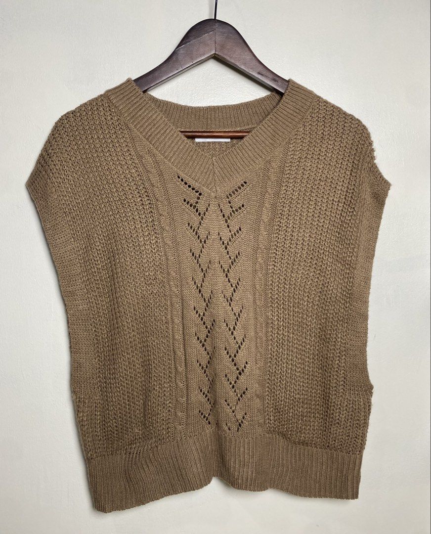 Khaki cable knit vest (Category: Others Tops) located in Makati City. Submitted by indaysukaycloset (Listing ID 1465816795, Image 1). Description: KHAKI CABLE KNIT VEST Brand: 2PINK (Japan Brand) Size: L on tag - Fits M-L Color: Khaki / Camel Brown / Mocha Details: - W-18.5 L-21 (laid flat, in inches) - Bust 86~94cm / Height 154~162cm (from tag) - V-neck sleeveless knit vest - Eyelet / pointelle pattern center + cable knit details - Ribbed neckli