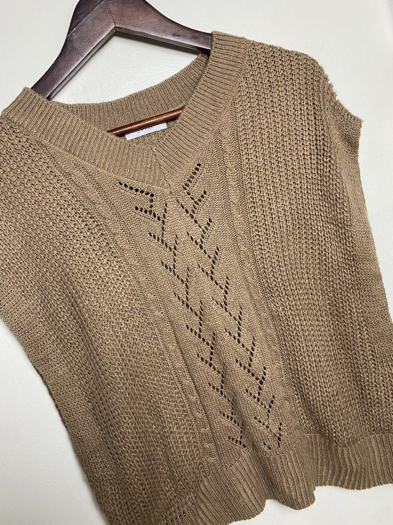 Khaki cable knit vest (Category: Others Tops) located in Makati City. Submitted by indaysukaycloset (Listing ID 1465816795, Image 2). Description: KHAKI CABLE KNIT VEST Brand: 2PINK (Japan Brand) Size: L on tag - Fits M-L Color: Khaki / Camel Brown / Mocha Details: - W-18.5 L-21 (laid flat, in inches) - Bust 86~94cm / Height 154~162cm (from tag) - V-neck sleeveless knit vest - Eyelet / pointelle pattern center + cable knit details - Ribbed neckli