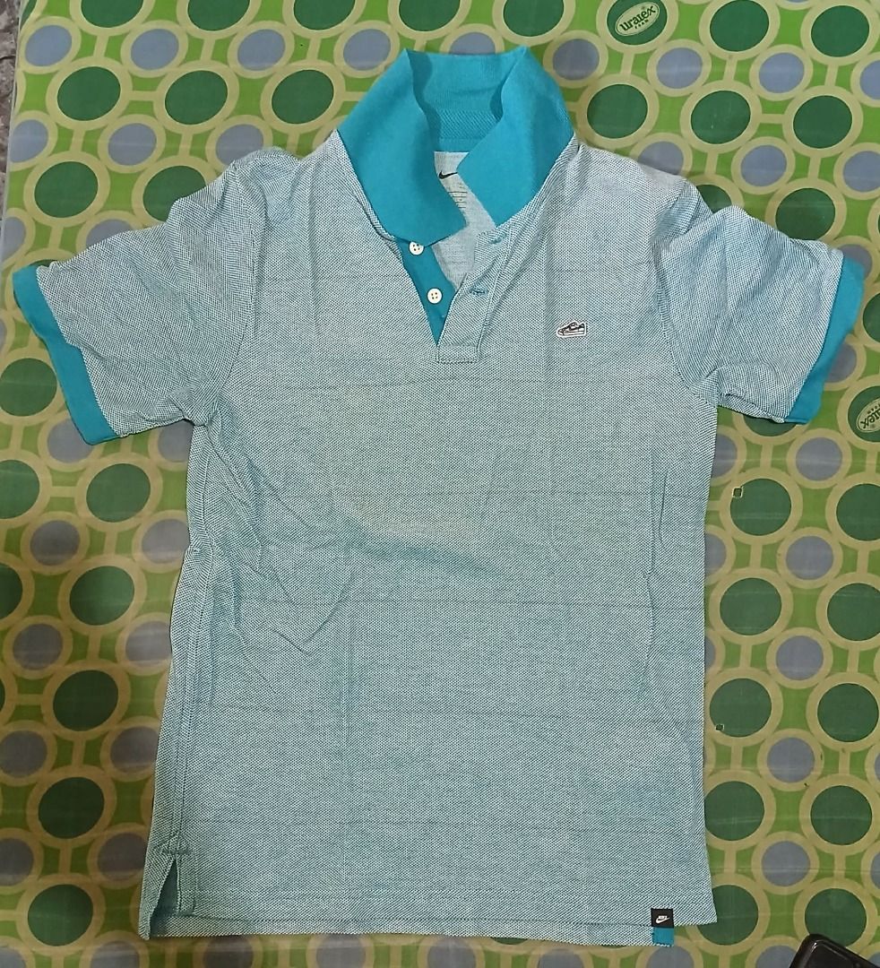 Nike Polo Shirt (Category: Babies & Kids Fashion) located in Balagtas. Submitted by janlex (Listing ID 1465819745, Image 1). Description: NIKE shirt in size M (70cm chest). Made of 100% lightweight textured cotton with an extra button included. Excellent Condition...