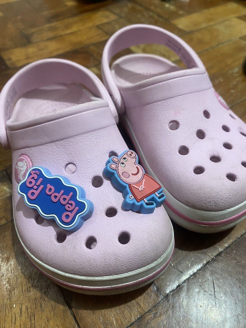 Kids Crocs Pink Clogs Size C8 (Category: Babies & Kids Fashion) located in Taguig. Submitted by mumpreloveddd (Listing ID 1465928697, Image 1). Description: Pink kids clogs with Peppa Pig charms on the left shoe. Iconic Crocs comfort footbed. Heel strap attached. Size C8 stamped inside. Made in Vietnam. Minor wear on soles and uppers from normal use. Fun shoes for toddlers. - i can remove the jibbitz if you want. .