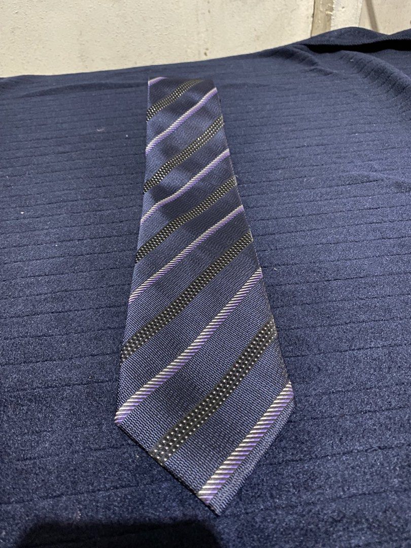Kissa Navy Blue Stripe Microfiber Necktie (Category: Ties) located in Manila. Submitted by resi.diaz (Listing ID 1465894260, Image 1). Description: - Brand: Kissa - Color: Navy blue with black and purple diagonal stripes - Material: 100% smooth microfiber - Width: Standard - Condition: Clean and ready to wear - Ideal for: Formal events, office wear, and business meetings.