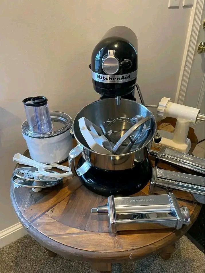 KitchenAid Stand Mixer with Pasta Maker and Attachments (Category: Hand & Stand Mixers) located in Pagadian. Submitted by teacher_rowelyn (Listing ID 1465952380, Image 1). Description: - Complete KitchenAid Heavy Duty Stand Mixer bundle in sleek black - Includes stainless steel bowl, wire whisk, dough hook, and flat beater - Comes with premium attachments: pasta roller, spaghetti cutter, food grinder, and food processor - Everything pictured on t